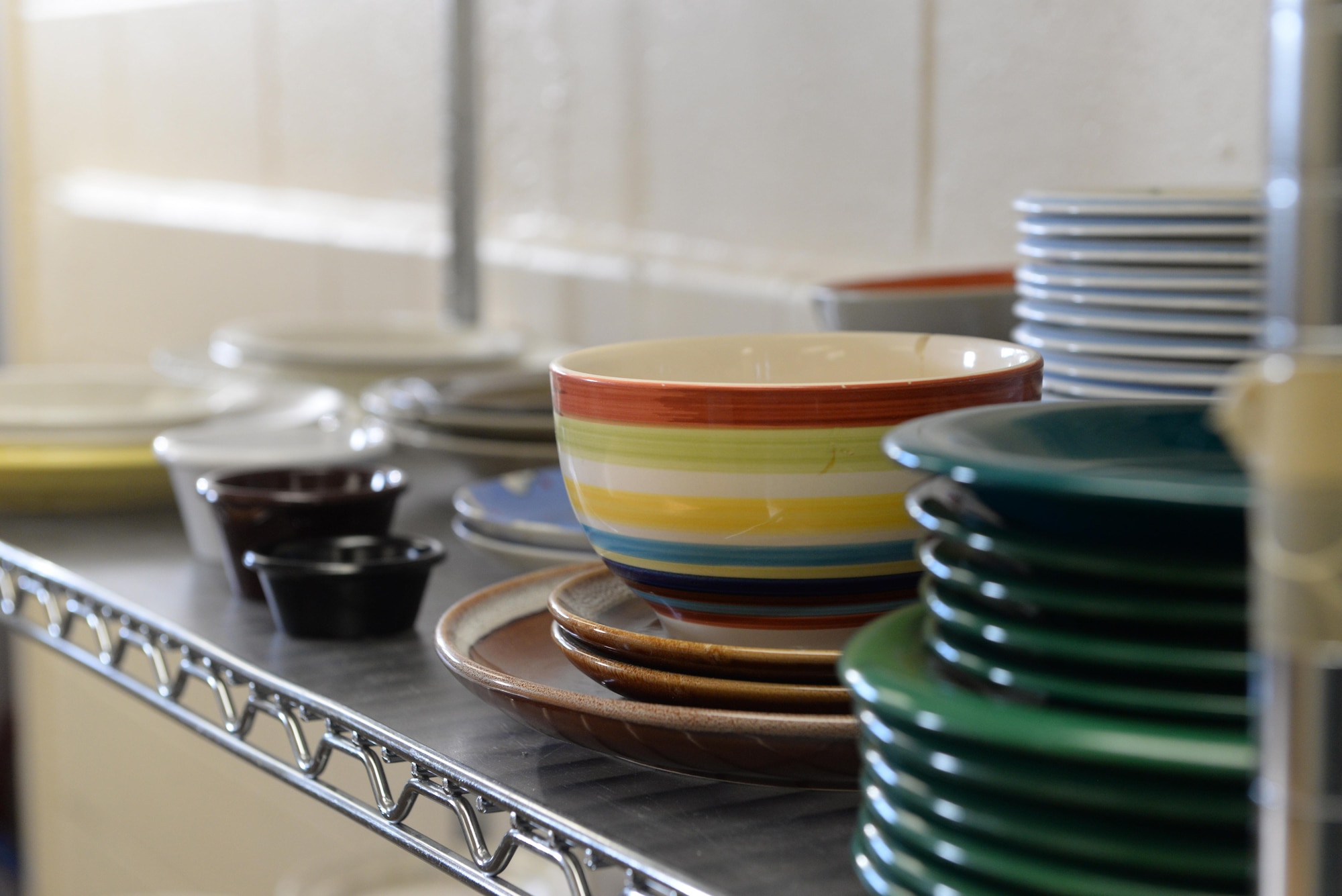 Kitchenware sits on a shelf in the Airman’s Attic on March 16, 2017, at Eielson Air Force Base, Alaska. The Eielson Airman’s Attic provides donated items at no cost to Airmen E-6 and below on Tuesday and Thursday, and all ranks on the first Saturday of each month. (U.S. Air Force photo by Airman Eric M. Fisher)