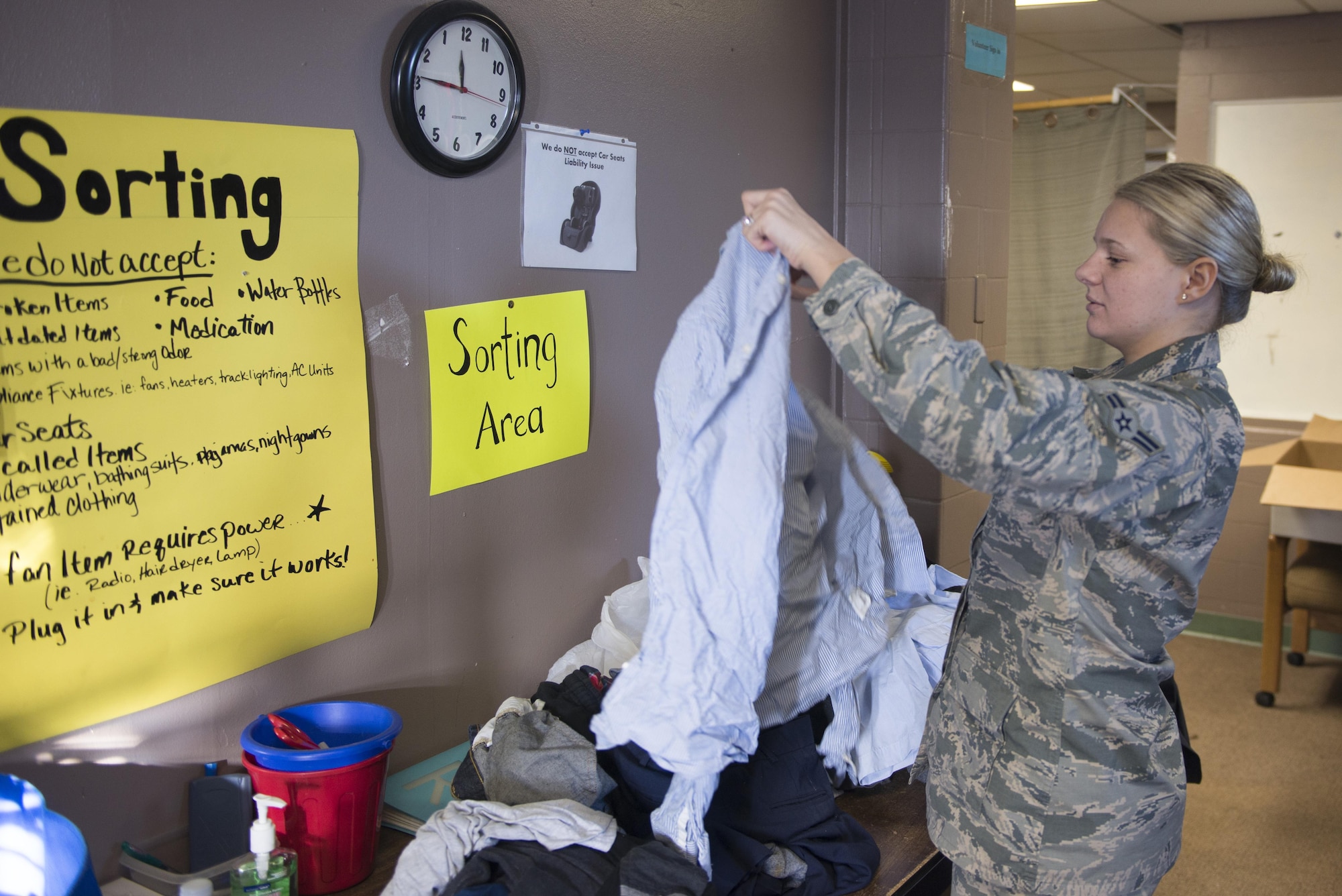U.S. Air Force Airman 1st Class Angela White, a 354th Force Support Squadron military personnel section customer service apprentice, sorts through donated clothing March 16, 2017, at Eielson Air Force Base, Alaska. White volunteers at the Airman’s Attic as often as possible to ensure the facility can remain open to her fellow Airmen. (U.S. Air Force photo by Airman Eric M. Fisher)