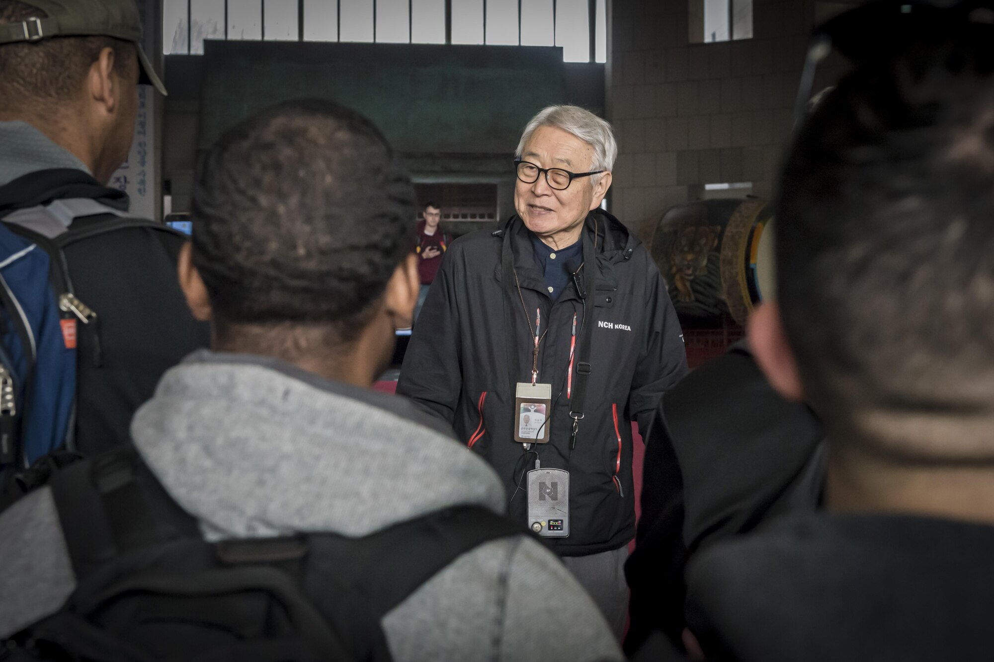 Lee Song Ha, a War Memorial of Korea tour guide, greets the 60 U.S. service members who volunteered for the chance to experience the country they’re here to protect during a cultural heritage tour in Seoul, Republic of Korea, March 18, 2017. Ha guided half the group through the museum sharing his nation’s history using facts and personal experience to connect the Americans with his nation’s past. Ha was six-years-old at the beginning of the war and now approaches his 75th birthday. (U.S. Air Force photo by Staff Sgt. Benjamin W. Stratton)