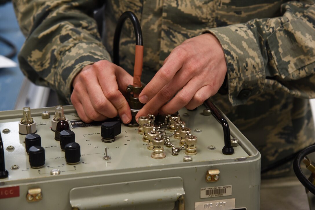 Staff Sgt. Edel Melendez Fred, 60th Maintenance Squadron precision measurement equipment laboratory technician, tests an aircraft transponder at Travis Air Force Base, Calif., March, 13, 2017. Melendez Fred works in the Precision Measurement Equipment Laboratory, which ensures test equipment meets required standards. (U.S. Air Force photo by Senior Airman Sam Salopek)