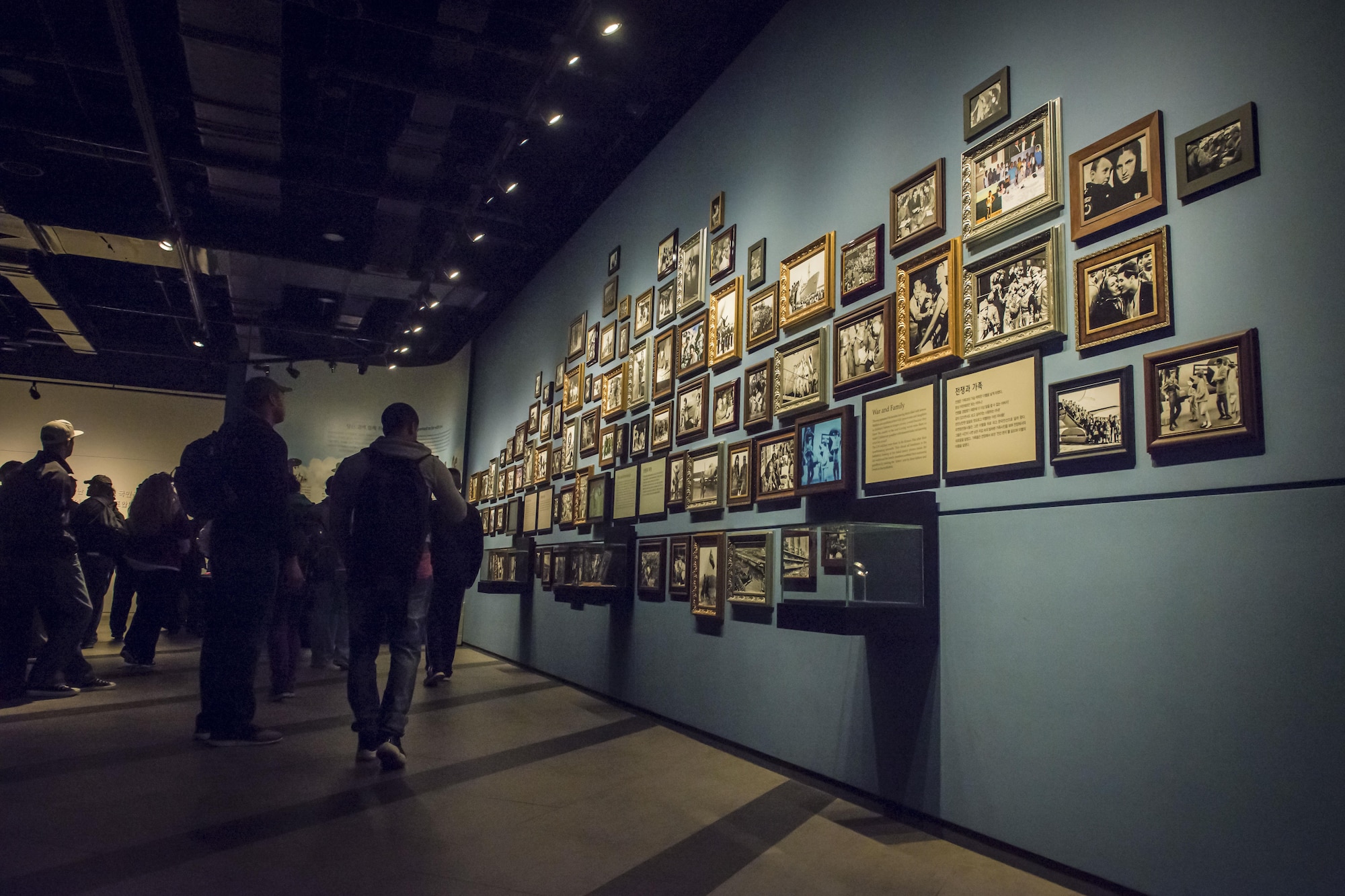 U.S. service members assigned to Key Resolve 2017 take a moment to look over a wall of black and white photos highlighting the sacrifice veterans from 16 United Nations sending states made for a people they barely knew at the War Memorial of Korea in Seoul, Republic of Korea, March 18, 2017. A plaque at the center of the photos entitled, “War and Friendship,” reads, “When you face the uncertainty of life and death, the only people you could trust were their fellow soldiers in the battlefield.” The memorial depicts the immense bond U.N. and ROK soldiers felt during the war. A soldier’s battle buddy, regardless of nationality, became like family. (U.S. Air Force photo by Staff Sgt. Benjamin W. Stratton)