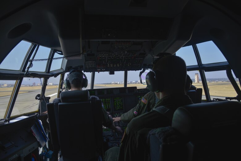 Crew members of the 36th Airlift Squadron prepare to take off during the first C-130J Super Hercules training sortie at Yokota Air Base, Japan, March 20, 2017. The C-130J incorporates state-of-the-art technology to reduce manpower requirements, lower operating and support costs, and provide life-cycle cost savings over earlier C-130 models. (U.S. Air Force photo by Staff Sgt. David Owsianka)