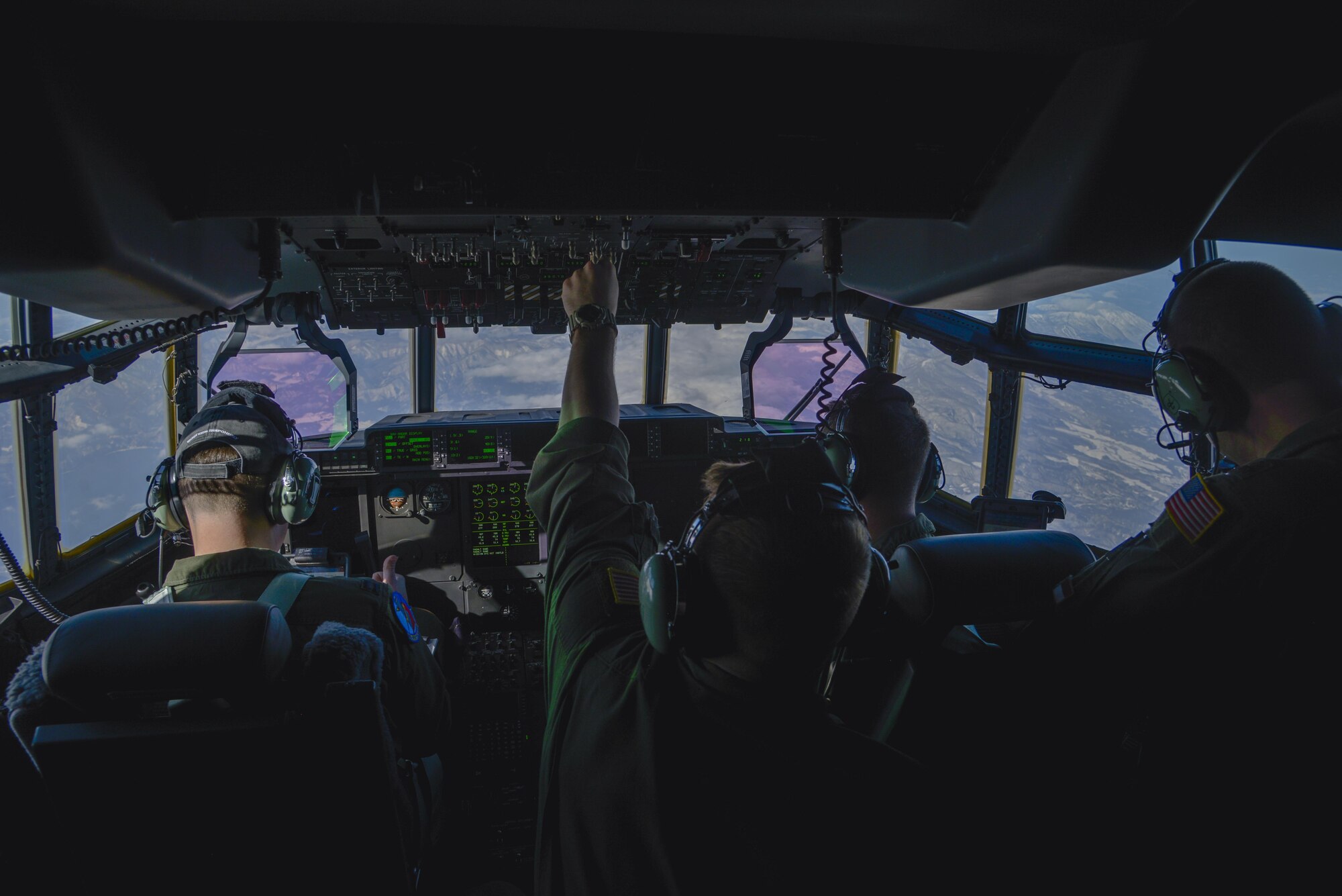 Staff Sgt. Christopher Hofer, 36th Airlift Squadron loadmaster, flips a fuel panel switch during the first Yokota C-130J Super Hercules training sortie over the skies of Japan March 20, 2017. By flipping the switch, the crew members are able to properly balance the fuel tanks. (U.S. Air Force photo by Staff Sgt. David Owsianka)