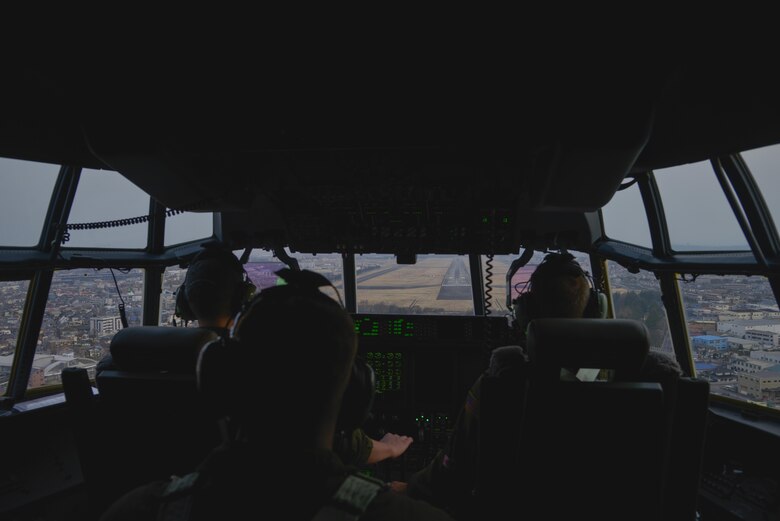 Crew members of the 36th Airlift Squadron approach the runway at Yokota Air Base, Japan, during the first Yokota C-130J Super Hercules training sortie March 20, 2017. The C-130J incorporates state-of-the-art technology to reduce manpower requirements, lower operating and support costs, and provide life-cycle cost savings over earlier C-130 models. (U.S. Air Force photo by Staff Sgt. David Owsianka)