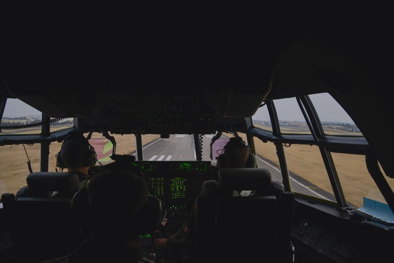 Crew members of the 36th Airlift Squadron prepare to land at Yokota Air Base, Japan, during the first Yokota C-130J Super Hercules training sortie March 20, 2017. The pilots performed multiple touch and go training scenarios at Misawa and Yokota Air Base, Japan. (U.S. Air Force photo by Staff Sgt. David Owsianka)