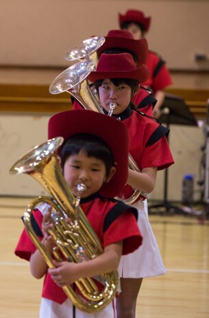 Japanese students from the Shunan International Children’s Club perform in a line together during the Japanese Cultural Exchange Program at Marine Corps Air Station Iwakuni, Japan, March 20, 2017. The Shunan International Children’s Club traveled to the air station to give the students an opportunity to experience Japanese singing, dancing and martial arts. (U.S. Marine Corps photo by Pfc. Stephen Campbell)