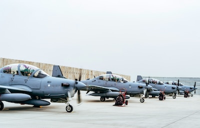 Train, Advise, Assist Command-Air advisors welcome a U.S. pilot to Kabul Air Wing in Kabul, Afghanistan, after he transported an A-29 Super Tucano light-attack aircraft, March 20, 2017. The A-29s will be used by the Afghan Air Force for close-air attack, air interdiction, escort and armed reconnaissance. Air Force photo by Tech. Sgt. Veronica Pierce