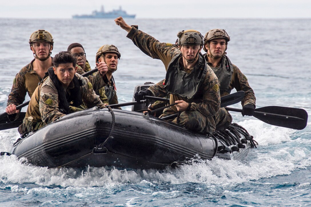 Marines navigate a combat rubber raiding craft into the well deck of the USS Bonhomme Richard after a helocast exercise in the Philippine Sea, March 19, 2017. The Bonhomme Richard Expeditionary Strike Group is on a routine patrol in the Indo-Asia-Pacific region. Navy photo by Petty Officer 3rd Class Jeanette Mullinax