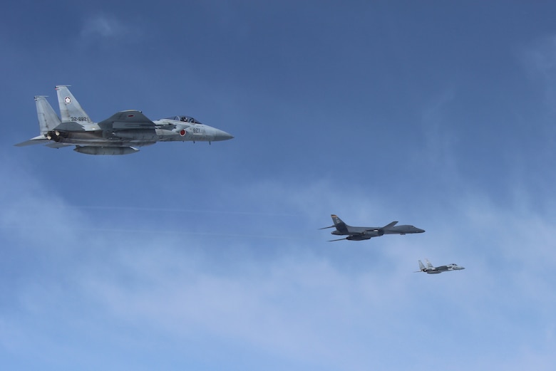 A U.S. Air Force B-1B Lancer flies in formation with Japan Air Self Defense Force F-15s in the vicinity of Japan March 21, 2017. The sortie was carried out as part of U.S. Pacific Command's continuous bomber presence mission.