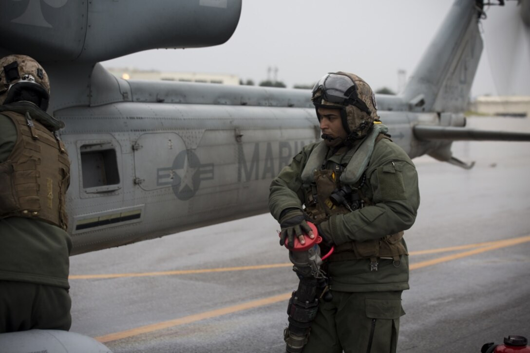 Sgt. Kevin Carpio, a UH-1Y crew chief with Marine Light Attack Helicopter Squadron 267, currently supporting Marine Aircraft Group 36, 1st Marine Aircraft Wing, III Marine Expeditionary Force through the unit deployment program, finishes refueling the UH-1Y Venom at Marine Corps Air Station Iwakuni, Japan, March 11, 2017. The squadron, based out of Camp Pendleton, California, validated the long-range capability of the auxiliary fuel tanks on their H-1 platform helicopters by flying 314 nautical miles during one leg of the four-day mission, March 10. These aircrafts’ extended range is crucial to maintaining a stronger, more capable forward-deployed force in the Indo-Asia-Pacific region. Carpio is from Bronx, New York. (U.S. Marine Corps photo by Lance Cpl. Andy Martinez)