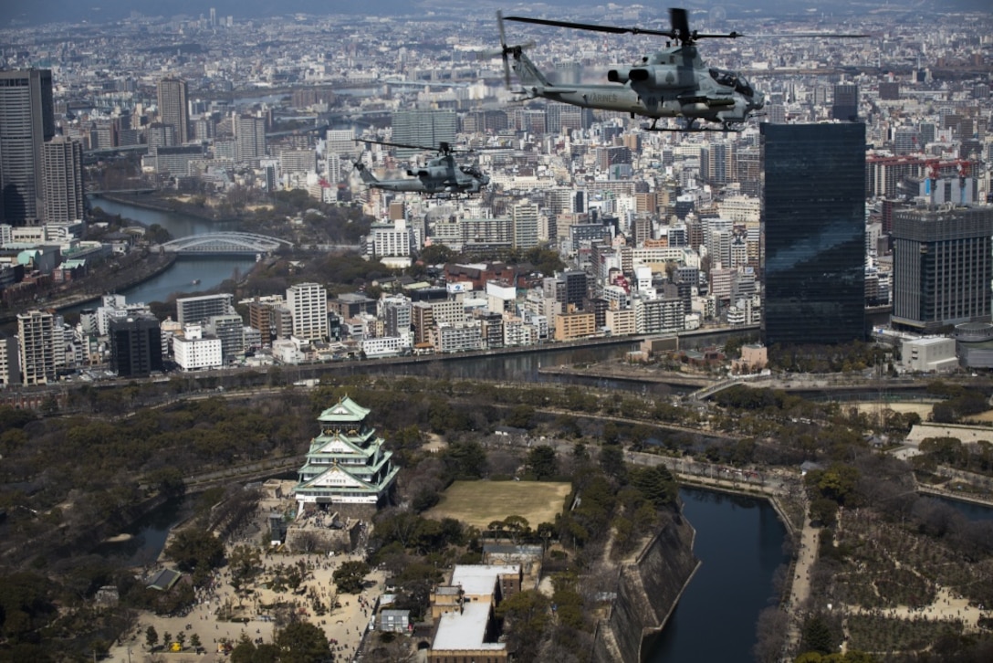 AH-1Z Vipers soar through the skies over Osaka Castle, Osaka, Japan, March 12, 2017. Marine Light Attack Helicopter Squadron 267 validated the long-range capability of the auxiliary fuel tanks on their H-1 platform helicopters by flying 314 nautical miles during one leg of the journey, March 10. These aircrafts’ extended range is crucial to maintaining a stronger, more capable forward-deployed force in the Asia-Indo-Pacific region. The Marines in the aircraft are with HMLA-267, currently assigned to Marine Aircraft Group 36, 1st Marine Aircraft Wing, III Marine Expeditionary Force through the unit deployment program. The squadron is based out of Camp Pendleton, California. (U.S. Marine Corps photo by Lance Cpl. Andy Martinez)