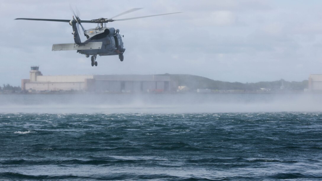An MH-60R assigned to Helicopter Maritime Strike Squadron 37 conducts search and rescue drills off the shores of Marine Corps Base Hawaii on March 15, 2017. The Sailors conducted the exercise to better prepare for future deployments. 