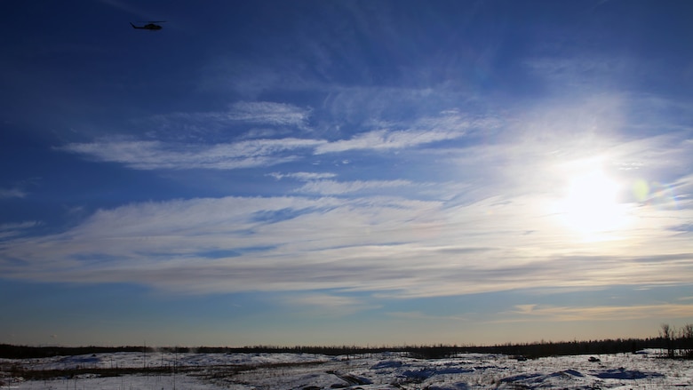 An AH-1W Super Cobra flies over a range during cold weather training operations near Fort Drum, N.Y., March 16, 2017. Marines assigned to Marine Light Attack Helicopter Squadron 269, Marine Aircraft Group 29, 2nd Marine Aircraft Wing, conducted close air support with live ordnance to simulate real world operations in a forward position. 