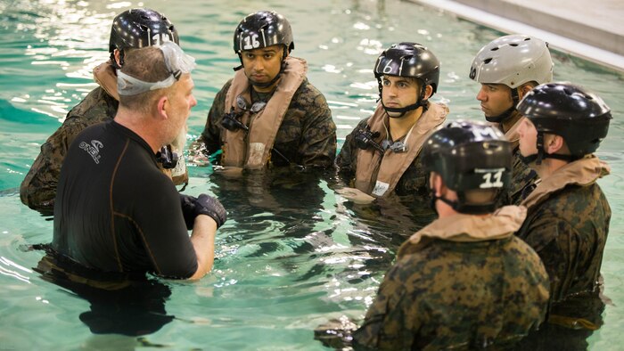 Marines with Special Purpose Marine Air-Ground Task Force - Southern Command are briefed after completing the Modular Amphibious Egress Trainer during Underwater Egress Training at the Water Survival Training Facility on Marine Corps Base Camp Lejeune, North Carolina, March 8, 2017. The purpose of the training is to teach Marines lifesaving skills in the event of an aircraft mishap in the water. 