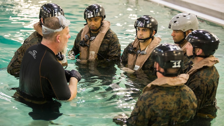 Marines with Special Purpose Marine Air-Ground Task Force - Southern Command are briefed after completing the Modular Amphibious Egress Trainer during Underwater Egress Training at the Water Survival Training Facility on Marine Corps Base Camp Lejeune, North Carolina, March 8, 2017. The purpose of the training is to teach Marines lifesaving skills in the event of an aircraft mishap in the water. 