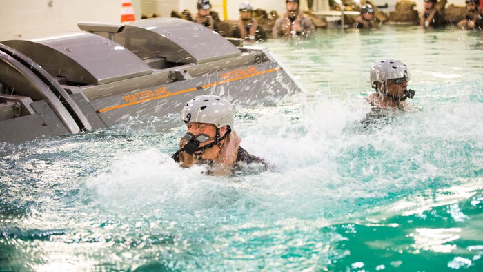 Marines with Special Purpose Marine Air-Ground Task Force - Southern Command emerge from the water after completing the Modular Amphibious Egress Trainer during Underwater Egress Training at the Water Survival Training Facility on Marine Corps Base Camp Lejeune, North Carolina, March 8, 2017. The purpose of the training is to teach Marines lifesaving skills in the event of an aircraft mishap in the water. 