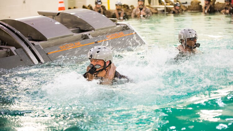 Marines with Special Purpose Marine Air-Ground Task Force - Southern Command emerge from the water after completing the Modular Amphibious Egress Trainer during Underwater Egress Training at the Water Survival Training Facility on Marine Corps Base Camp Lejeune, North Carolina, March 8, 2017. The purpose of the training is to teach Marines lifesaving skills in the event of an aircraft mishap in the water. 