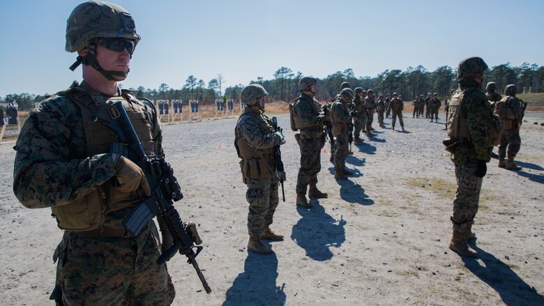 Marines with Special Purpose Marine Air-Ground Task Force - Southern Command prepare for their next course of fire at a Table 5 short distance range during pre-deployment training at Range K-501A on Marine Corps Base Camp Lejeune, North Carolina, March 16, 2017. The training was conducted to enhance the Ground Combat Element’s readiness for future security cooperation operations in Central America. 