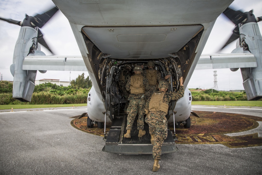 Marines with the 3rd Marine Division's Chemical, Biological, Radiological and Nuclear Platoon board an MV-22 Osprey at Camp Courtney Landing Zone, Okinawa, Japan, March 21, 2017. Marine Corps photo by Lance Cpl. Jesus McCloud