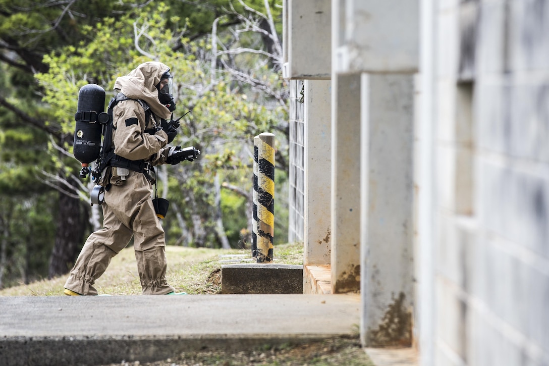 Marine Corps Cpl. Joshua Hatfield uses a Multirae device to detect simulated biological contamination in Combat Town, Okinawa, Japan, March 21, 2017. Hatfiled is a member of the 3rd Marine Division's Chemical, Biological, Radiological and Nuclear Platoon response element. Marine Corps photo by Lance Cpl. Jesus McCloud