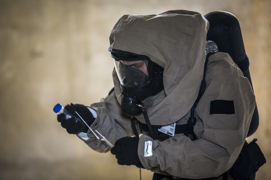 Marine Corps Cpl. Joshua Hatfield takes sample swabs of simulated hazards on Combat Town, Okinawa, Japan, March 21, 2017. Hatfield is assigned to the 3rd Marine Division's Chemical, Biological, Radiological and Nuclear Platoon. Marine Corps photo by Lance Cpl. Jesus McCloud