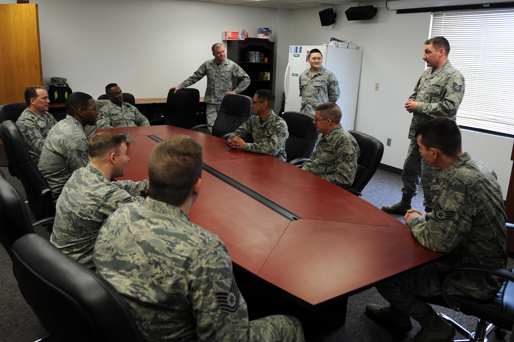 Chief Master Sgt. Calvin Williams, Air Force Global Strike command chief, listens to Airmen from base operations at Minot Air Force Base, N.D., March 9, 2017. Williams visited units and spoke about Air Force and AFGSC topics. (U.S. Air Force photo/Senior Airman Kristoffer Kaubisch)