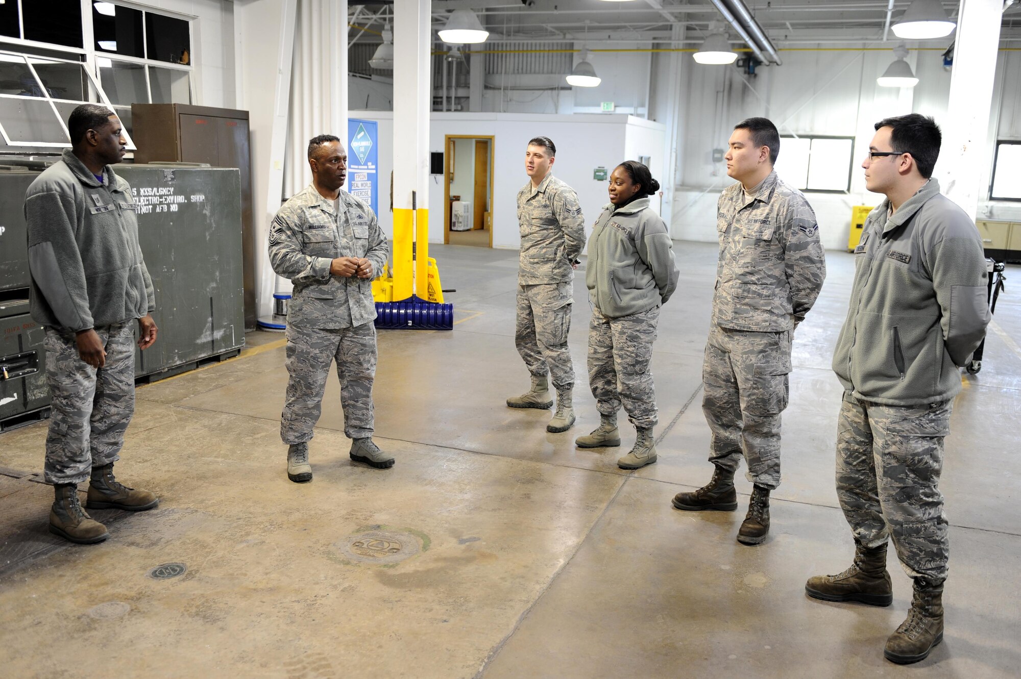 Chief Master Sgt. Calvin Williams, Air Force Global Strike command chief, speaks with several Airmen at Minot Air Force Base, N.D., March 9, 2017. Williams visited several units on base to discuss the importance of their missions. (U.S. Air Force photo/Senior Airman Kristoffer Kaubisch)