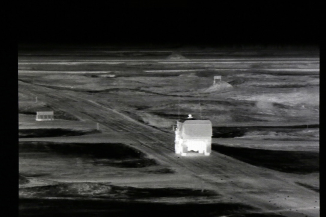 A thermal image of a Light Medium Tactical Vehicle gunnery crew moves onto the firing lane during a night live-fire gunnery qualification at the Operation Cold Steel exercise conducted at Fort McCoy, Wisconsin, Mar. 20, 2017. Operation Cold Steel is the U.S. Army Reserve’s first large-scale live-fire training and crew-served weapons qualification and validation exercise. Cold Steel plays a critical role in ensuring that America’s Army Reserve units and Soldiers are trained and ready to deploy on short-notice and bring combat-ready and lethal firepower in support of the Total Army and Joint Force partners anywhere in the world. In support of the Total Army Force, First Army Master Gunners participated in Cold Steel to provide expertise in crew level gunnery qualifications, and to develop Vehicle Crew Evaluator training, preparing units here and when they return to their home stations to conduct crew served weapons training and vehicle crew gunnery at the unit-level. 475 crews with an estimated 1,600 Army Reserve Soldiers will certify in M2, M19 and M240 Bravo gunner platforms across 12-day rotations through the seven-week exercise. 
(U.S. Army Reserve photo by Master Sgt. Anthony L. Taylor)