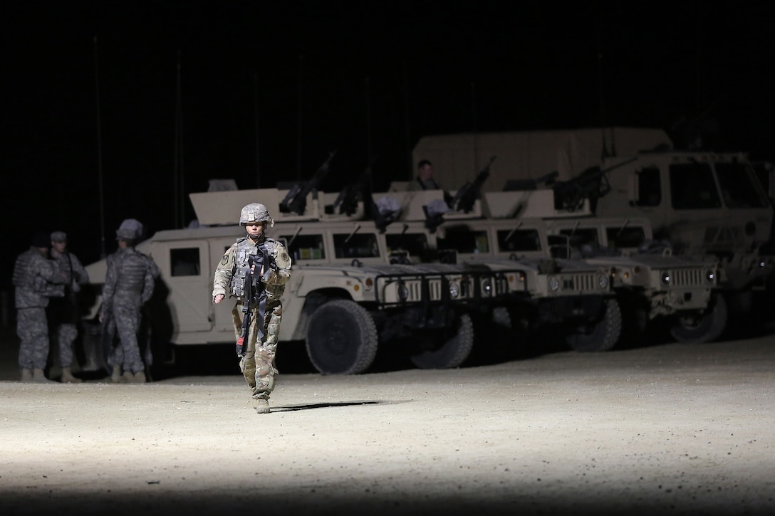 Sgt. 1st Class Cheri Gorney, 182nd Transportation Company, 103rd Sustainment Command (Expeditionary) walks across the range ahead of a night live-fire gunnery qualification during the Operation Cold Steel exercise conducted at Fort McCoy, Wisconsin, Mar. 20, 2017. Operation Cold Steel is the U.S. Army Reserve’s first large-scale live-fire training and crew-served weapons qualification and validation exercise. Cold Steel plays a critical role in ensuring that America’s Army Reserve units and Soldiers are trained and ready to deploy on short-notice and bring combat-ready and lethal firepower in support of the Total Army and Joint Force partners anywhere in the world. In support of the Total Army Force, First Army Master Gunners participated in Cold Steel to provide expertise in crew level gunnery qualifications, and to develop Vehicle Crew Evaluator training, preparing units here and when they return to their home stations to conduct crew served weapons training and vehicle crew gunnery at the unit-level. 475 crews with an estimated 1,600 Army Reserve Soldiers will certify in M2, M19 and M240 Bravo gunner platforms across 12-day rotations through the seven-week exercise. 
(U.S. Army Reserve photo by Master Sgt. Anthony L. Taylor)