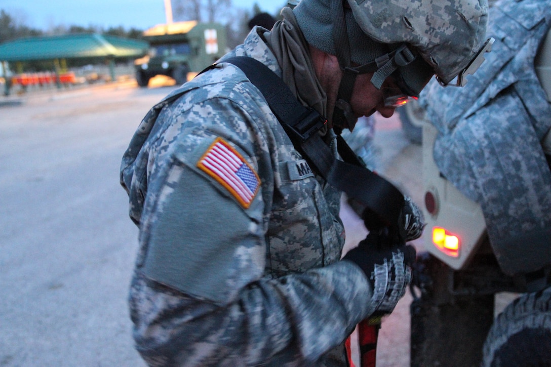 U.S. Army Reserve Pvt. John Dimatteo, 375th Combat Sustainment Support Battalion, U.S. Army Civil Affairs and Psychological Operations Command, puts his gunner’s harness on in preparation for night live-fire qualification during Operation Cold Steel at Fort McCoy, Wis., March 20, 2017. Operation Cold Steel is the U.S. Army Reserve's crew-served weapons qualification and validation exercise to ensure that America's Army Reserve units and Soldiers are trained and ready to deploy on short-notice and bring combat-ready and lethal firepower in support of the Army and our joint partners anywhere in the world. (U.S. Army Reserve photo by Staff Sgt. Debralee Best, 84th Training Command)