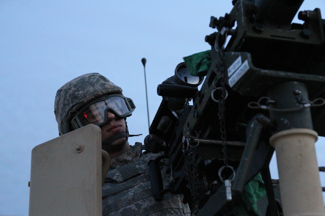 U.S. Army Reserve Spc. Zachary Albrant, Headquarters and Headquarters Company, 406th Combat Sustainment Support Battalion, U.S. Army Reserve Aviation Command, wipes down his weapon in preparation for night live-fire qualification  during Operation Cold Steel at Fort McCoy, Wis., March 20, 2017. Operation Cold Steel is the U.S. Army Reserve's crew-served weapons qualification and validation exercise to ensure that America's Army Reserve units and Soldiers are trained and ready to deploy on short-notice and bring combat-ready and lethal firepower in support of the Army and our joint partners anywhere in the world. (U.S. Army Reserve photo by Staff Sgt. Debralee Best, 84th Training Command)