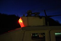 U.S. Army Reserve Pvt. John Dimatteo, 375th Combat Sustainment Support Battalion, U.S. Army Civil Affairs and Psychological Operations Command, watches his vehicle commander pick up ammunition for night live-fire qualification during Operation Cold Steel at Fort McCoy, Wis., March 20, 2017. Operation Cold Steel is the U.S. Army Reserve's crew-served weapons qualification and validation exercise to ensure that America's Army Reserve units and Soldiers are trained and ready to deploy on short-notice and bring combat-ready and lethal firepower in support of the Army and our joint partners anywhere in the world. (U.S. Army Reserve photo by Staff Sgt. Debralee Best, 84th Training Command)