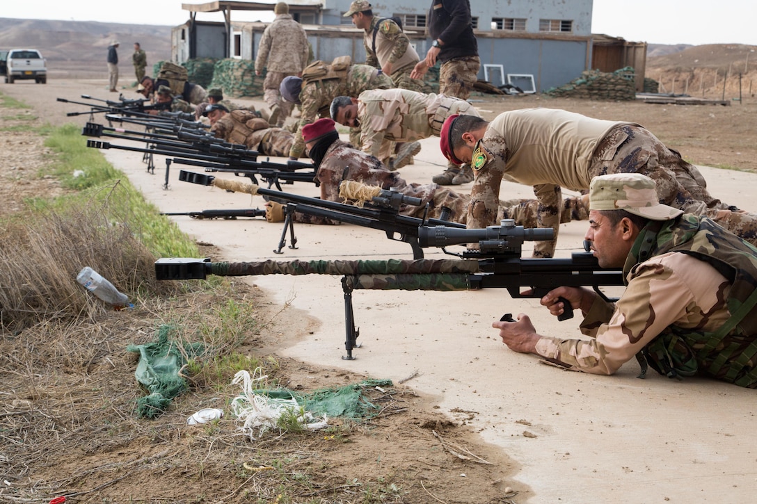 Iraqi security forces soldiers prepare their sniper rifles during advanced marksmanship training at Camp Manion, Iraq, March 19, 2017. Coalition forces train ISF advanced combat skills in support of Combined Joint Task Force – Operation Inherent Resolve, the global Coalition to defeat ISIS in Iraq and Syria.  (U.S. Army photo by Spc. Christopher Brecht)