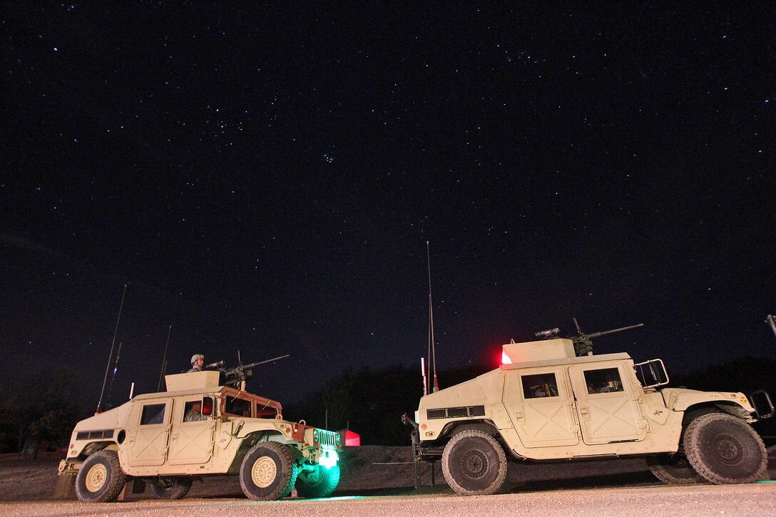 Vehicle gunnery crews stand by in their firing order ahead of a night live-fire gunnery qualification during the Operation Cold Steel exercise conducted at Fort McCoy, Wisconsin, Mar. 20, 2017. Operation Cold Steel is the U.S. Army Reserve’s first large-scale live-fire training and crew-served weapons qualification and validation exercise. Cold Steel plays a critical role in ensuring that America’s Army Reserve units and Soldiers are trained and ready to deploy on short-notice and bring combat-ready and lethal firepower in support of the Total Army and Joint Force partners anywhere in the world. In support of the Total Army Force, First Army Master Gunners participated in Cold Steel to provide expertise in crew level gunnery qualifications, and to develop Vehicle Crew Evaluator training, preparing units here and when they return to their home stations to conduct crew served weapons training and vehicle crew gunnery at the unit-level. 475 crews with an estimated 1,600 Army Reserve Soldiers will certify in M2, M19 and M240 Bravo gunner platforms across 12-day rotations through the seven-week exercise. 
(U.S. Army Reserve photo by Master Sgt. Anthony L. Taylor)