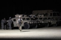 Sgt. 1st Class Cheri Gorney, 182nd Transportation Company, 103rd Sustainment Command (Expeditionary) walks across the range ahead of a night live-fire gunnery qualification during the Operation Cold Steel exercise conducted at Fort McCoy, Wisconsin, Mar. 20, 2017. Operation Cold Steel is the U.S. Army Reserve’s first large-scale live-fire training and crew-served weapons qualification and validation exercise. Cold Steel plays a critical role in ensuring that America’s Army Reserve units and Soldiers are trained and ready to deploy on short-notice and bring combat-ready and lethal firepower in support of the Total Army and Joint Force partners anywhere in the world. In support of the Total Army Force, First Army Master Gunners participated in Cold Steel to provide expertise in crew level gunnery qualifications, and to develop Vehicle Crew Evaluator training, preparing units here and when they return to their home stations to conduct crew served weapons training and vehicle crew gunnery at the unit-level. 475 crews with an estimated 1,600 Army Reserve Soldiers will certify in M2, M19 and M240 Bravo gunner platforms across 12-day rotations through the seven-week exercise. 
(U.S. Army Reserve photo by Master Sgt. Anthony L. Taylor)