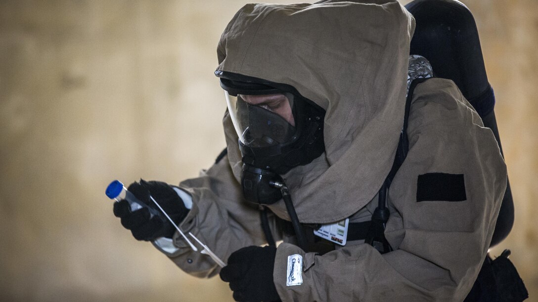 U.S. Marine Corps Cpl. Joshua Hatfield, Recon Team Leader, with Chemical, Biological, Radiological and Nuclear Platoon, G-3, 3d Marine Division, takes sample swabs of simulated CBRN hazards at Combat Town, Okinawa, Japan, March 21, 2017. The CBRN Platoon conducts response drills to enhance the commander’s capabilities by exercising the operability and efficiency of the consequence management set within the 3d Marine Division CBRN response element.