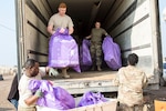U.S. Army Soldiers from the 387th Postal Platoon, unload bags of mail in Taji, Iraq, on Feb. 15, 2017. Soldiers working in the mail room can process roughly 30 to 450 bags of mail weekly. (U.S. Army photo by Sgt. Cesar E. Leon)