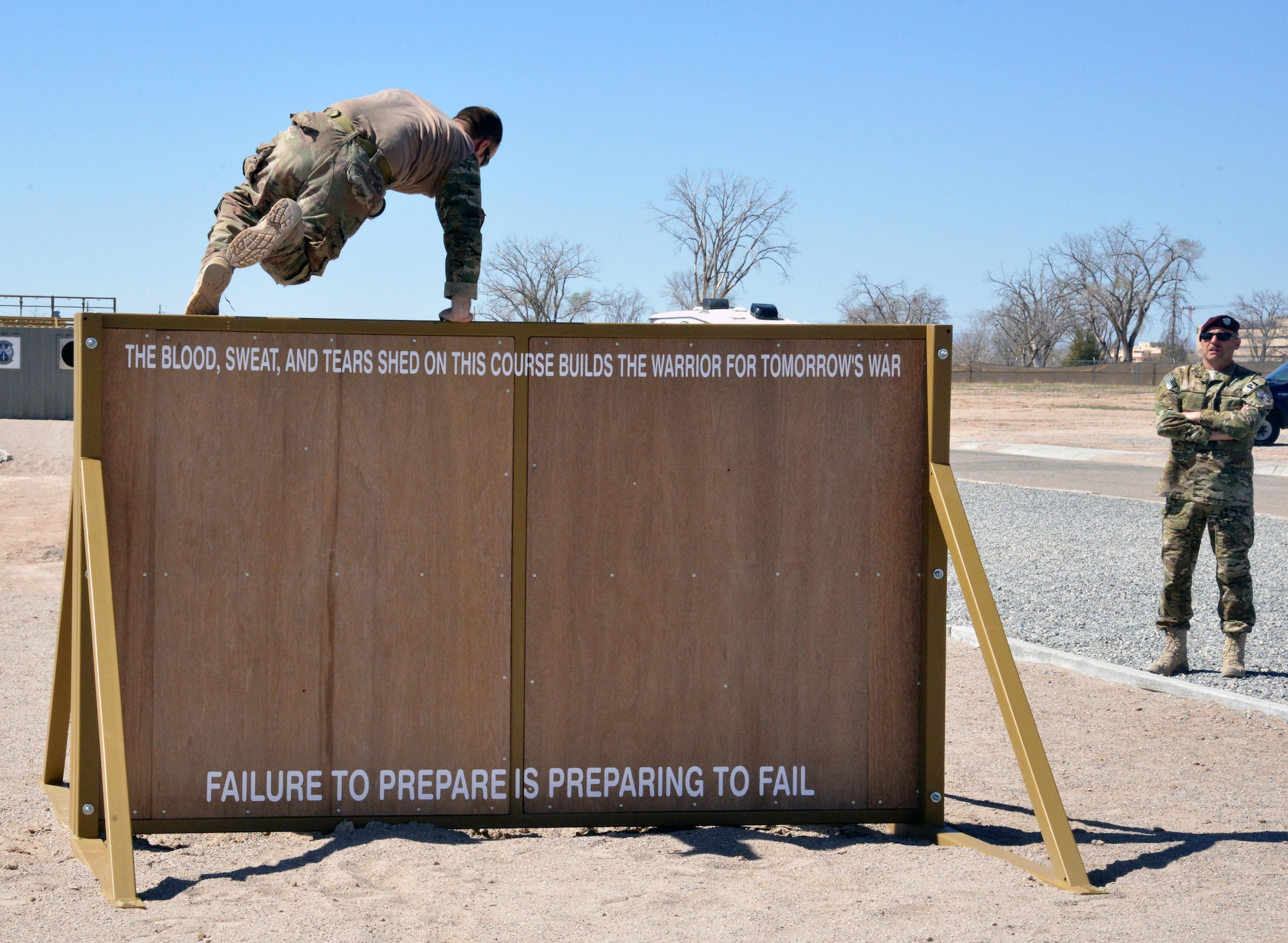 Pararescue trainees from the 351st Battlefield Airmen Training Squadron test the unit's new assault course March 17 at Kirtland. The course includes challenges like low crawls, rope and rock climbing, and jumping over a high wall, and will be used in training BATS students. (U.S. Air Force Photo/Senior Airman Chandler Baker)