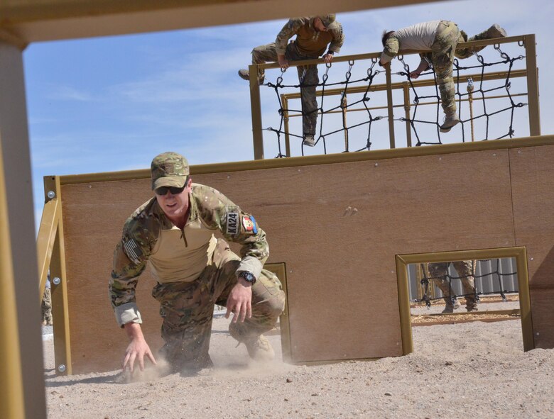Pararescue trainees from the 351st Battlefield Airmen Training Squadron test the unit's new assault course March 17 at Kirtland. The course includes challenges like low crawls, rope and rock climbing, and jumping over a high wall, and will be used in training BATS students. (U.S. Air Force Photo/Senior Airman Chandler Baker)