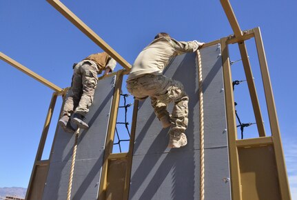 Pararescue trainees from the 351st Battlefield Airmen Training Squadron test the unit's new assault course March 17 at Kirtland. The course includes challenges like low crawls, rope and rock climbing, and jumping over a high wall, and will be used in training BATS students. (U.S. Air Force Photo/Senior Airman Chandler Baker)