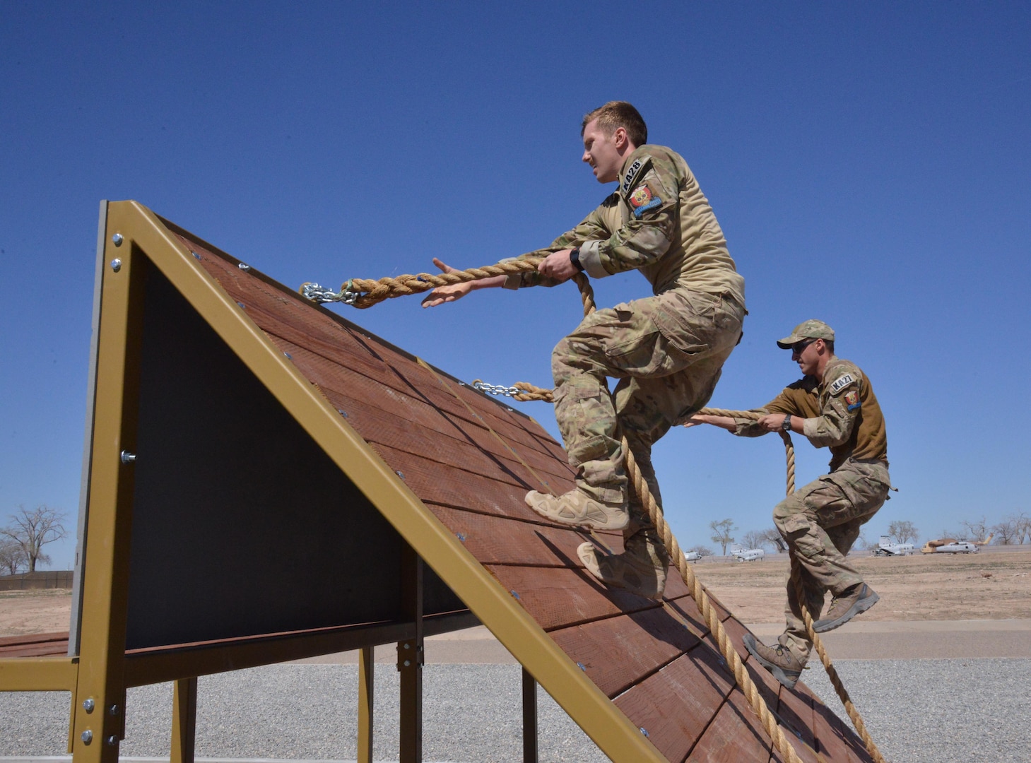 Pararescue trainees from the 351st Battlefield Airmen Training Squadron test the unit's new assault course March 17 at Kirtland. The course includes challenges like low crawls, rope and rock climbing, and jumping over a high wall, and will be used in training BATS students. (U.S. Air Force Photo/Senior Airman Chandler Baker)