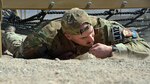 A pararescue trainees from the 351st Battlefield Airmen Training Squadron competes in the unit's new assault course March 17 at Kirtland. The course includes challenges like low crawls, rope and rock climbing, and jumping over a high wall, and will be used in training BATS students. (U.S. Air Force Photo/Senior Airman Chandler Baker)