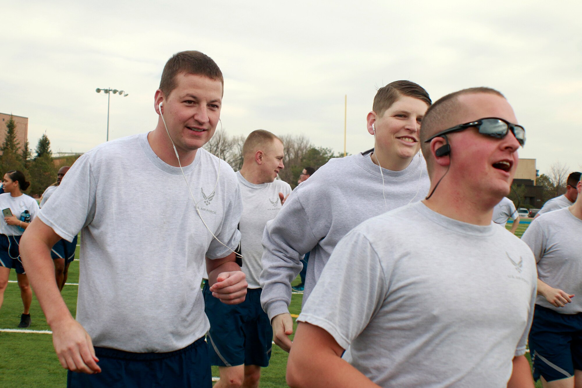 PETERSON AIR FORCE BASE, Colo.— Members of the 21st Space Wing warm up to the sounds of Blue Steel for Wing War Fit at Peterson Air Force Base, Colorado, March 21, 2017. The 21st Space Wing War Fit is a monthly event in which members of the wing get together for physical fitness. (U.S. Air Force photo by Shellie-Anne Espinosa)
