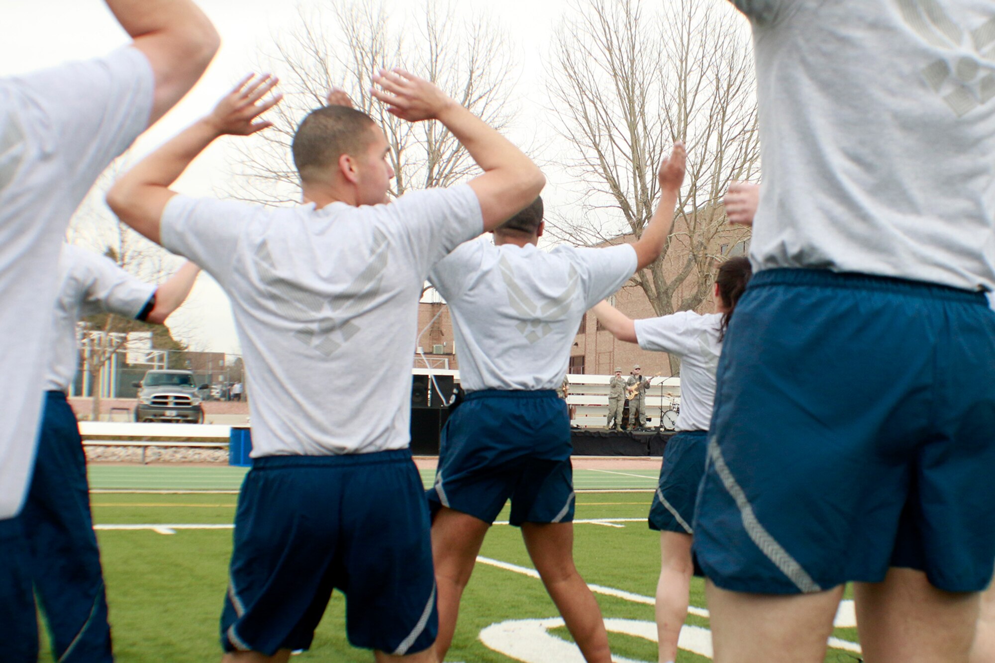 PETERSON AIR FORCE BASE, Colo. — Members of the 21st Space Wing warm up to the sounds of Blue Steel for Wing War Fit at Peterson Air Force Base, Colorado, March 21, 2017. Blue Steel, the commercial, popular music ensemble of the United States Air Force Academy Band, debuted a new song when runners began the 5K portion of the Wing War Fit. (U.S. Air Force photo by Shellie-Anne Espinosa)