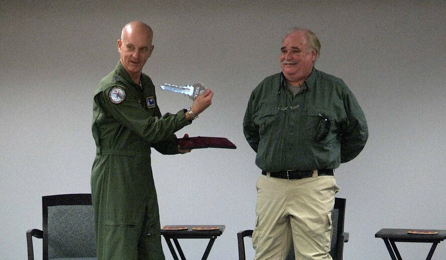 Local business owner, Danny Thompson, donates a ceremonial Titan One missile launch key to the Air Force, March 8, 2017. Global Strike Command vice commander, Maj. Gen. Michael Fortney, accepted the key, which will be taken to the Barksdale Global Power Museum. (U.S. Air Force photo by Staff Sgt. Anthony Flores)