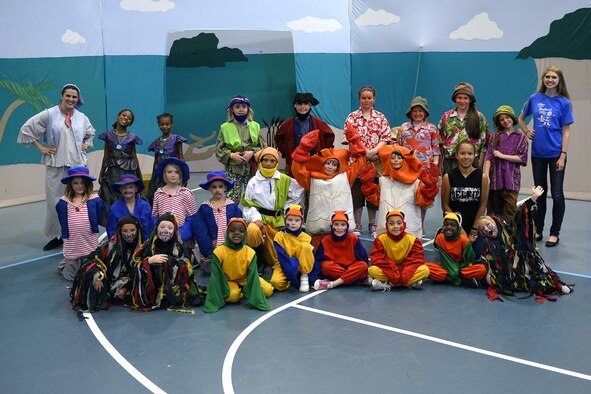 The cast of "Black Beard and the Pirates" gather for a curtain call following the opening performance of the play, organized by the Missoula Children’s Theatre, in the fitness center gym at Schriever Air Force Base, Colorado, July 31, 2015.  Schriever youth children spent a week learning their lines and routines with the help of MCT summer residents and held two performances of the show Friday afternoon.  The group is returning to Schriever March 27-31, 2017, to produce “The Wiz of the West.” (U.S. Air Force photo/Christopher DeWitt)