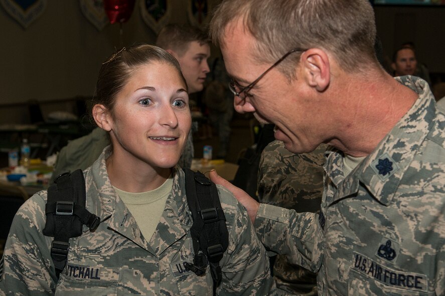 U.S. Air Force Staff Sgt. Amber Cutchall is welcomed home by Lt. Col. Warren Crabtree, 707th Maintenance Squadron (MXS) commander, after returning home from a six-month deployment on Mar. 20, 2017, Barksdale Air Force Base, La.  Cutchall is assigned to the Air Force Reserve Command’s 707th MXS and deployed to Southwest Asia in support of Operations Inherent Resolve and Freedom’s Sentinel. (U.S. Air Force photo by Master Sgt. Greg Steele/released)