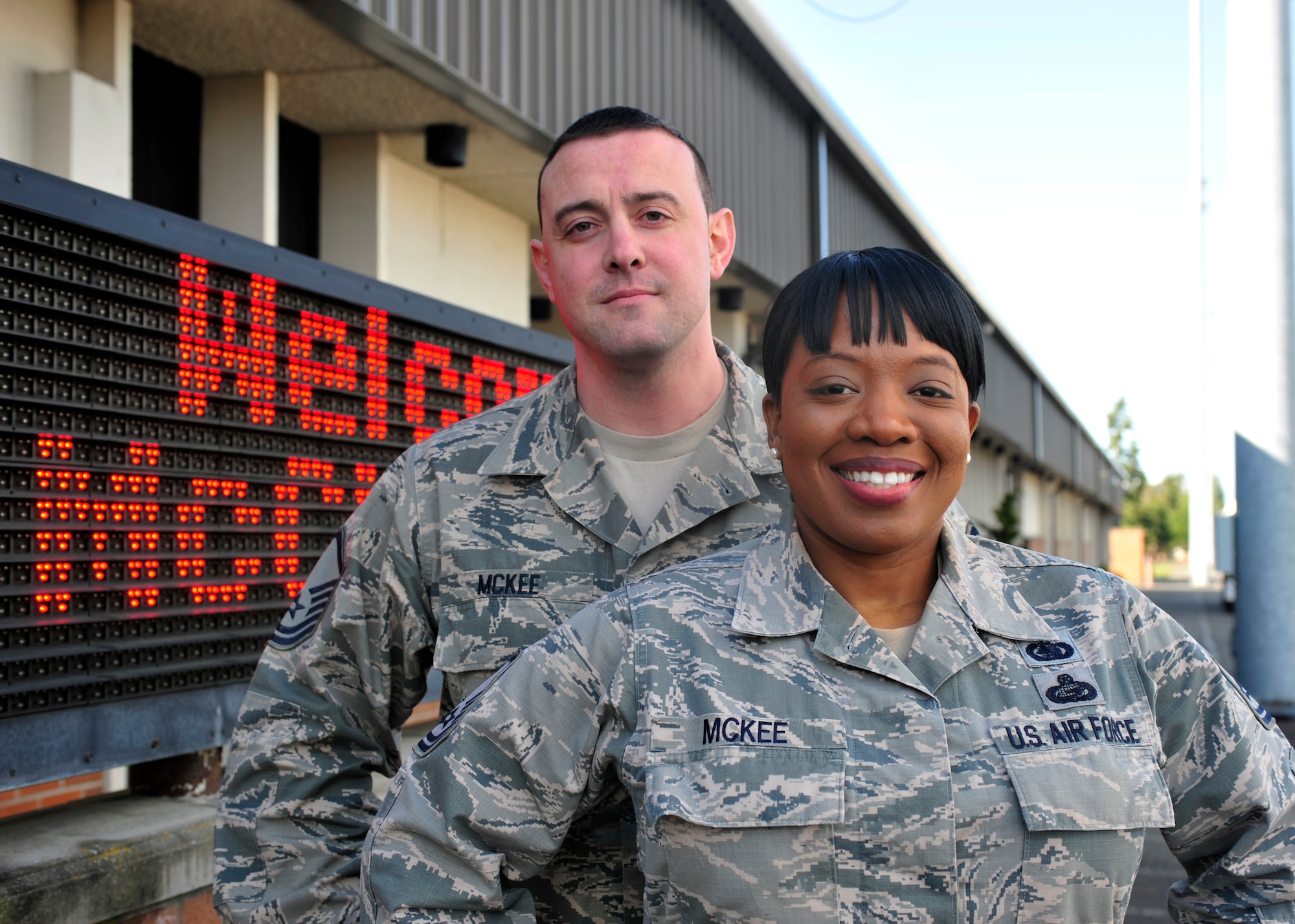 Master Sgt. Theodore (T.J.) McKee, 62nd Aerial Port Squadron passenger service operations NCOIC, and wife, Master Sgt. Tiffany McKee, 627th Logistics Readiness Squadron logistics plans superintendent, pose for a photo on the McChord Field flightline at Joint Base Lewis-McChord, Wash., March 16, 2017. T.J. was awarded NCO of the Year for 2016 while Tiffany was awarded SNCO of the Year at the Team McChord Annual Awards Banquet. March 10, 2017. (U.S. Air Force photo/Staff Sgt. Whitney Amstutz)