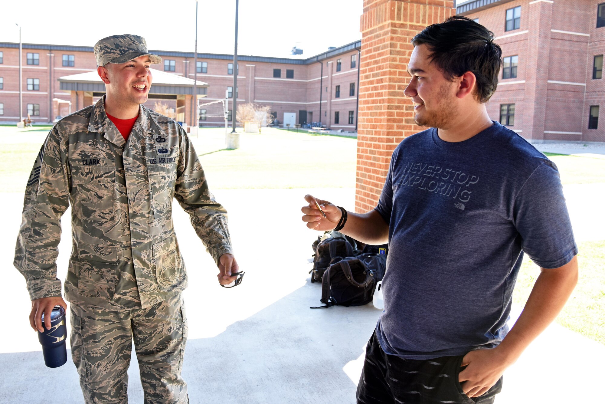 U.S. Air Force Senior Master Sgt. David Clark, 312th Training Squadron first sergeant, and Austin Weed, 312th TRS guest speaker, talk after Weed’s resiliency speech to a group of students at one of the training group pavilions on Goodfellow Air Force Base, Texas, March 17, 2017. Clark asked Weed to come to base to share the story of how he overcame the loss of his leg. (U.S. Air Force photo by Staff Sgt. Joshua Edwards/Released)