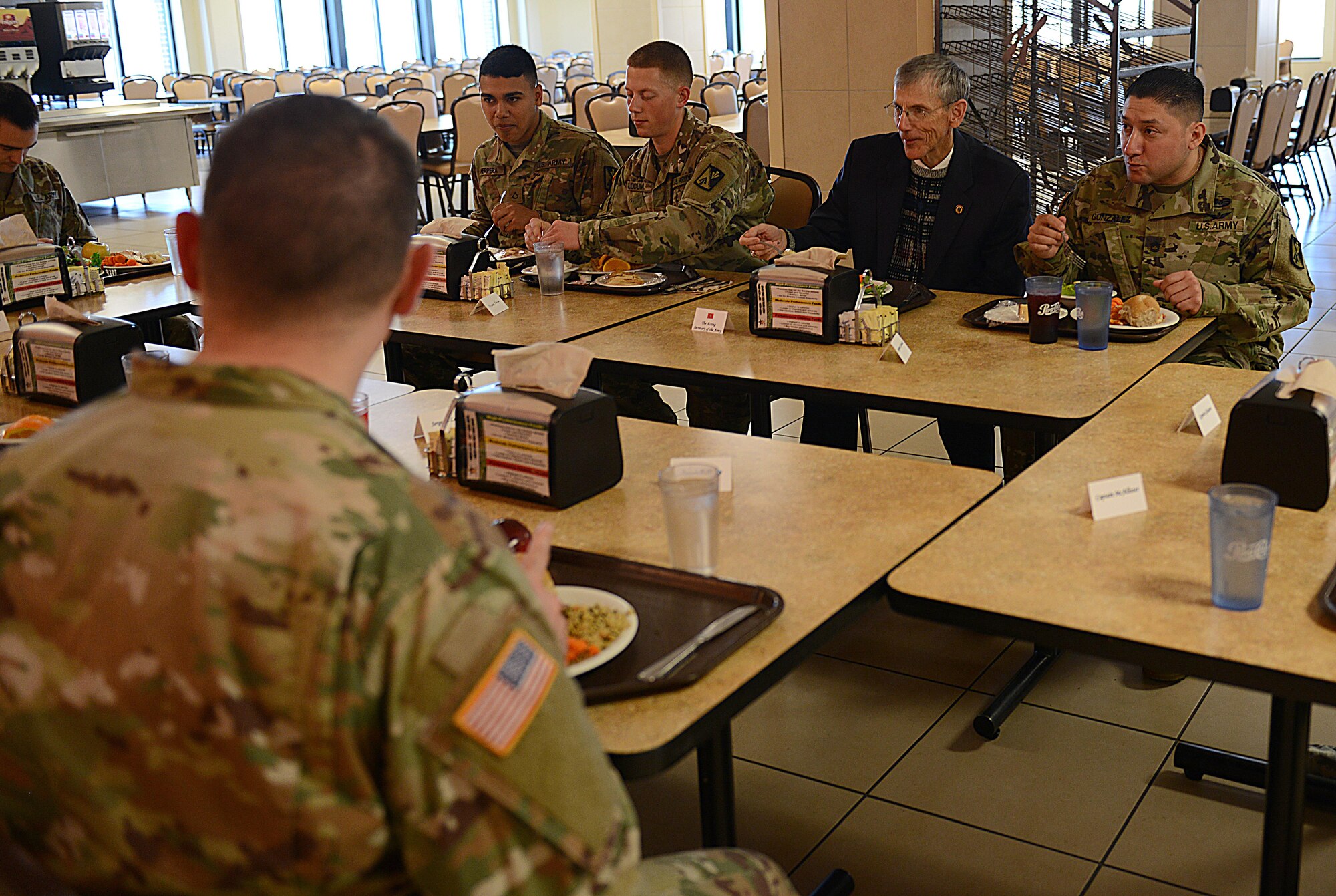 Acting Secretary of the Army Robert M. Speer eats lunch with 128th Aviation Brigade Advanced Individual Training students during a visit to Joint Base Langley-Eustis, Va., March 17, 2017. During his visit, Speer emphasized the priorities of the Secretary of Defense. (U.S. Air Force photo/Staff Sgt. Teresa J. Cleveland)